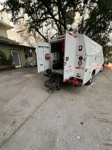 Magnet Plumbing service vehicle on-site for Grease Trap Cleaning in Merritt Island